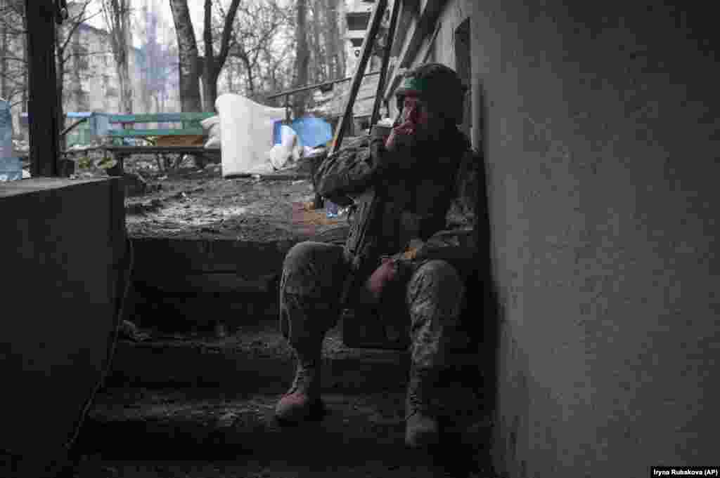 A Ukrainian soldier rests in Bakhmut. Taking control of the Bakhmut &quot;meat grinder,&quot; where thousands of soldiers are estimated to have been killed on both sides, would not only be a largely symbolic win for Moscow but would also allow its forces to focus on the Ukrainian garrisons around Chasiv Yar.
