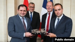 Armenian Defense Minister Suren Papikian (left) and French Defense Minister Sebastien Lecornu (right) in a photo released in conjunction with the CAESAR announcement on June 18.