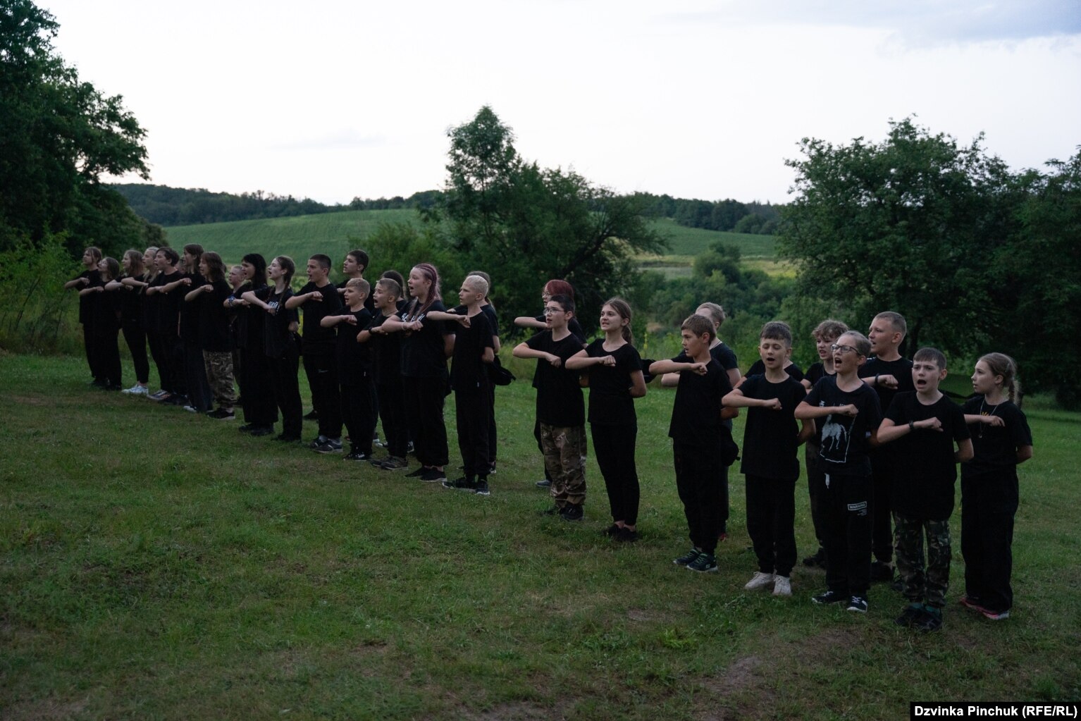 Children declaim the Prayer Of The Ukrainian Nationalist, a patriotic oath that is now popular among some military units in Ukraine.