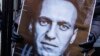 Плякат з фотаздымкам Аляксея Навальнага на акцыі памяці ў Нью-Ёрку, ЗША. Ілюстрацыйнае фота