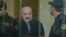 Vagif Khachatrian (center) in a military court in Baku on October 13.
