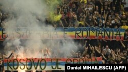 Romanian fans display banners reading (in Serbian) "Kosovo is Serbia" and (in Romanian) "Bessarabia is Romania" during the EURO 2024 qualifying match between Romania and Kosovo in Bucharest on September 12.