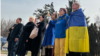 Kyrgyz activists take part in a gathering at the Ukrainian Embassy in Bishkek in a show of support for Ukraine, one year after Russia launched its full-scale military invasion, on February 24.