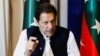 Former Pakistani Prime Minister Imran Khan speaks with reporters in Lahore on March 17.