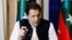 Former Pakistani Prime Minister Imran Khan speaks with reporters in Lahore on March 17.