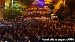 Armenians take part in an anti-government protest in central Yerevan on September 24.
