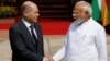 German Chancellor Olaf Scholz (left) shakes hands with Indian Prime Minister Narendra Modi before their meeting in New Delhi on February 25. 