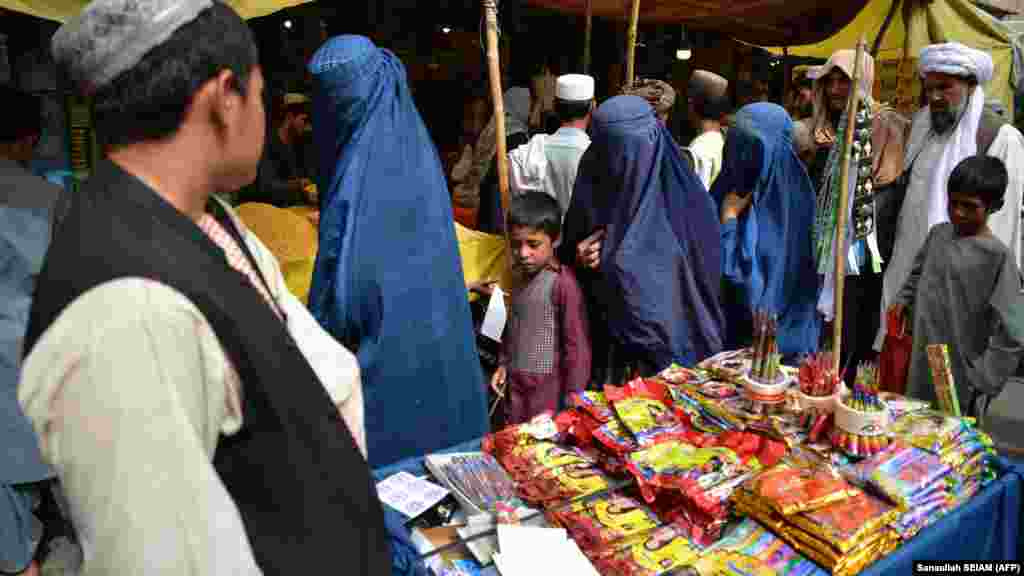 People throng a market in Kandahar ahead of the festival of Eid-al Adha. Decades of conflict, natural disasters, and economic challenges have fueled poverty across all segments of society as people struggle to earn a living. &nbsp;