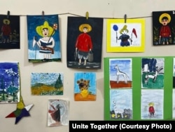 Paintings done by Ukrainian children are displayed in Tbilisi.