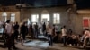 Nagorno-Karabakh - People wait in a line outside a bakery in Stepanakert, August 8, 2023.