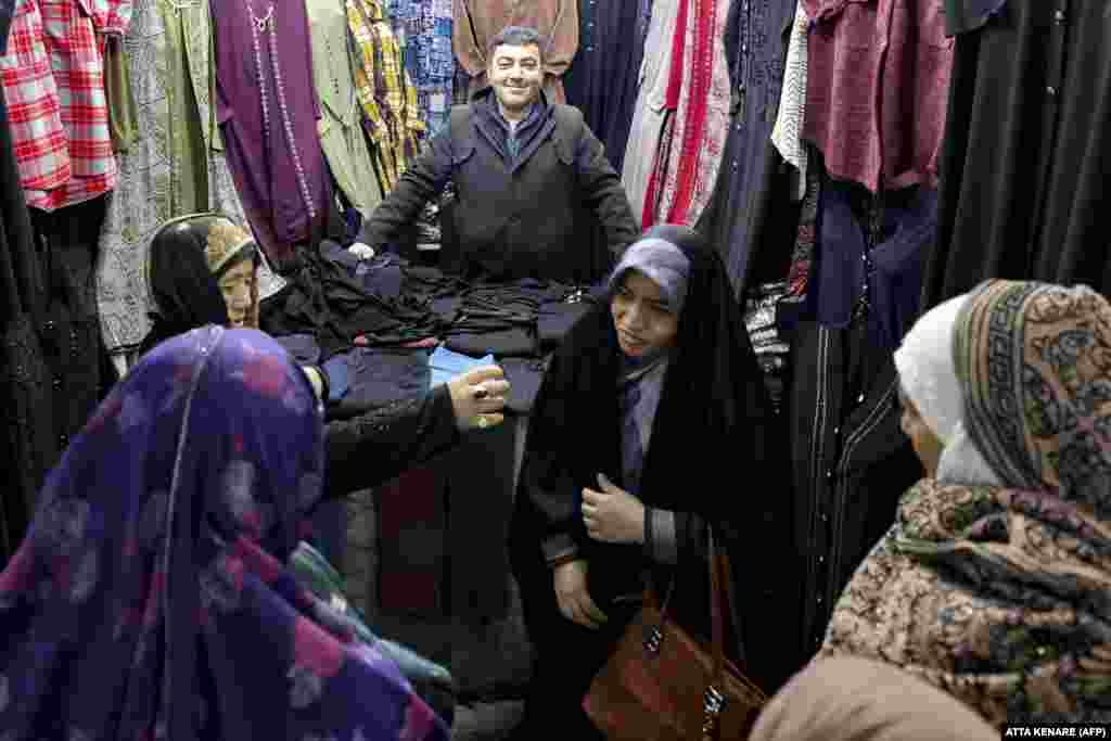 Women shop at a covered market in the Iranian city of Qom.