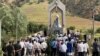 People in Kyrgyzstan's Jalal-Abad region attend a commemoration on June 13 for victims of ethnic clashes in 2010.