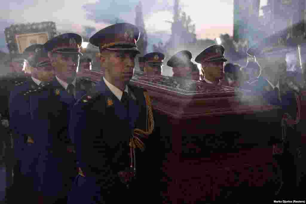 Ceremonial guards carry the coffin at the procession. Many Serbians have denounced what they say is a culture of violence in their country, sparking several anti-government protests. &nbsp;