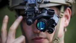 France -- A U.S. Air Force Forward air controller adjusts his night vision goggles 