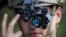 France -- A U.S. Air Force Forward air controller adjusts his night vision goggles 