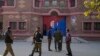 Police officers gather outside a police station in Warburton, an area of the Nankana district of Pakistan's eastern Punjab Province, on February 12. 