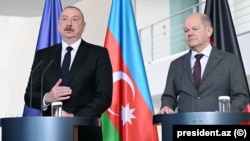 Azerbaijani President Ilham Aliyev and German Chancellor Olaf Scholz hold a joint press conference in Berlin on April 26.