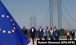Senior officials, including Romania’s President Klaus Iohannis (third from left) during the opening of the Braila Bridge on July 6.