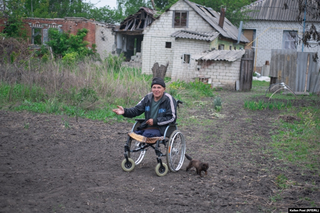Mykola dhe maçku i tij, Timukha në Kozaça Lopan, Ukrainë.
