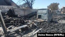 Truck burned in the yard of the Iliescu family from Crevedia