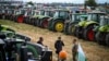 Farmers stand in front of their tractors during a protest against the lifting of a ban on imports of grain coming from Ukraine, in Dolni Bogrov, near Sofia, Bulgaria. (file photo)