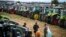 Farmers stand in front of their tractors during a protest against the lifting of a ban on imports of grain coming from Ukraine, in Dolni Bogrov, near Sofia, Bulgaria. (file photo)