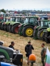 Farmers stand in front of their tractors during a protest against the lifting of a ban on imports of grain coming from Ukraine, in Dolni Bogrov, near Sofia, Bulgaria. (file photo)