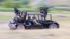 An &ldquo;anti-drone buggy&rdquo; being tested by Russian troops inside Ukraine in June 2024. The vehicle sports multiple automatic weapons mounted on a light chassis, and unspecified &ldquo;anti-drone weapons&rdquo; are apparently fired from grenade launch tubes seen at the front and rear of the vehicle.
