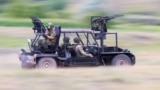 An &ldquo;anti-drone buggy&rdquo; being tested by Russian troops inside Ukraine in June 2024. The vehicle sports multiple automatic weapons mounted on a light chassis, and unspecified &ldquo;anti-drone weapons&rdquo; are apparently fired from grenade launch tubes seen at the front and rear of the vehicle.