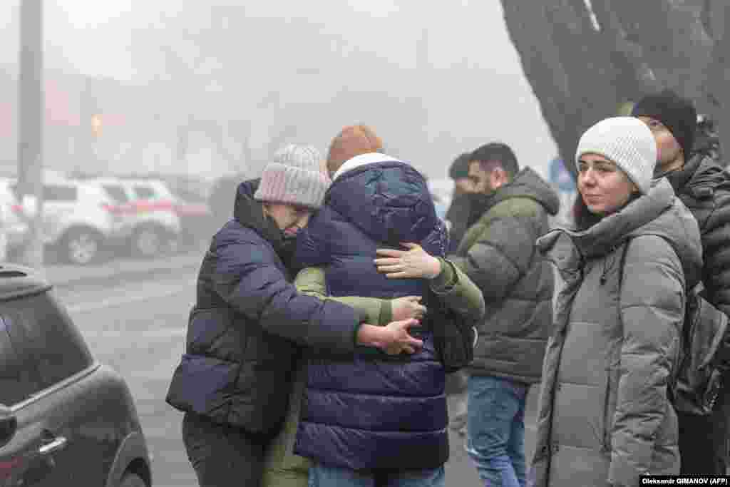 Odesa residents comfort one another. With rescue workers still working the scenes at several locations around&nbsp;the country, the death toll is expected to rise.