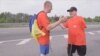 Two Ukrainian amputees, Serhii Khrapko and Oleksandr Shevtsov, walk to raise hospital funds, May, Kiyev, Ukraine