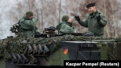 Polish instructors and Ukrainian soldiers train on Leopard 2 A4 tanks in the 10th Armored Cavalry Brigade in Swietoszow, Poland, on February 13.