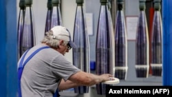 A man works on an assembly line making shells at a weapons factory in Germany. (file photo)