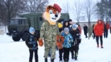 Children from Russian-occupied parts of Ukraine visit a military site in Belarus as part of a purported camp to get them out of a war zone. However, there is evidence the camps are being used to indoctrinate Ukrainian youth with Russian ideology. 