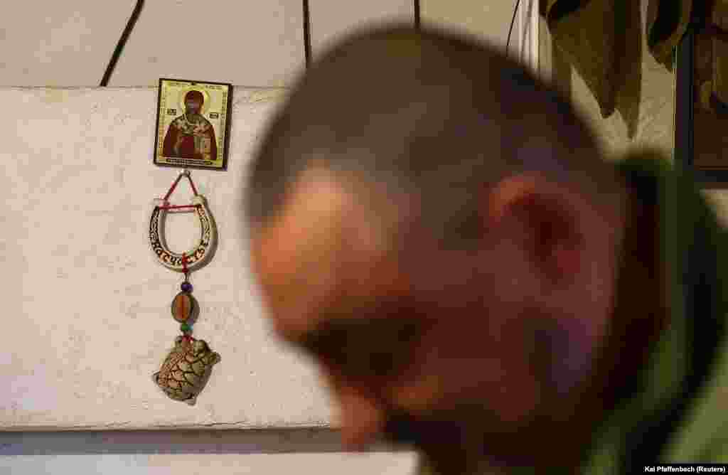 Religious icons adorn the wall where Ukrainian soldiers are resting.