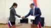 Armenia - Armenia's Deputy Minsiter of High-Technology Avet Poghosian and Russia's Deputy Minister of Mass Communication Bella Cherkesova sign a joint statement in Yerevan.