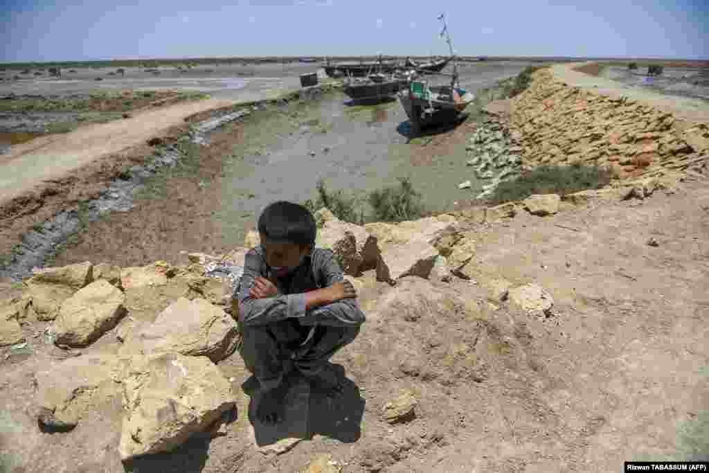 A boy waits to be evacuated to government relief camps before the due onset of a cyclone in the Sujawal district of Pakistan&#39;s Sindh Province.