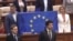 Moldova, Deputies holding EU flag in Parliament