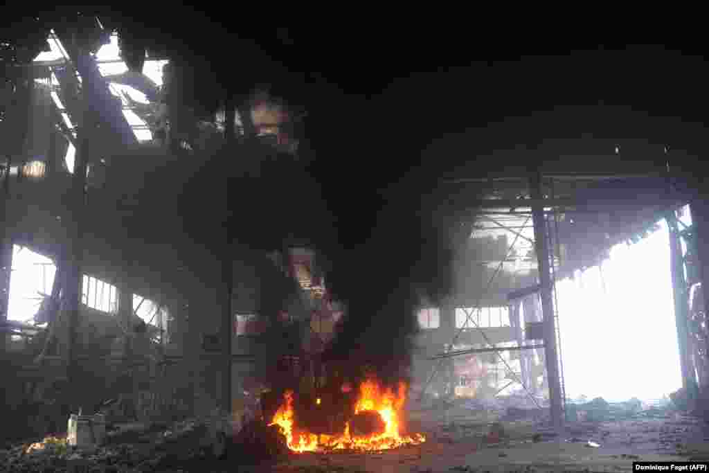 A vehicle burns inside the airport in October 16. Amid close-quarter fighting for control of the facility throughout late 2014 until early 2015, the airport was reduced to rubble as Russian-backed forces eventually regained control.&nbsp;