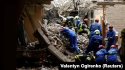 Rescuers work at the site of a destroyed building during a Russian missile strike in Chernihiv, Ukraine, on April 17.