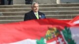 Hungarian Prime Minister Viktor Orban: hiding behind the flag? 