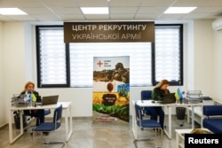 Employees of a newly opened Ukrainian Army recruitment center in Dnipro