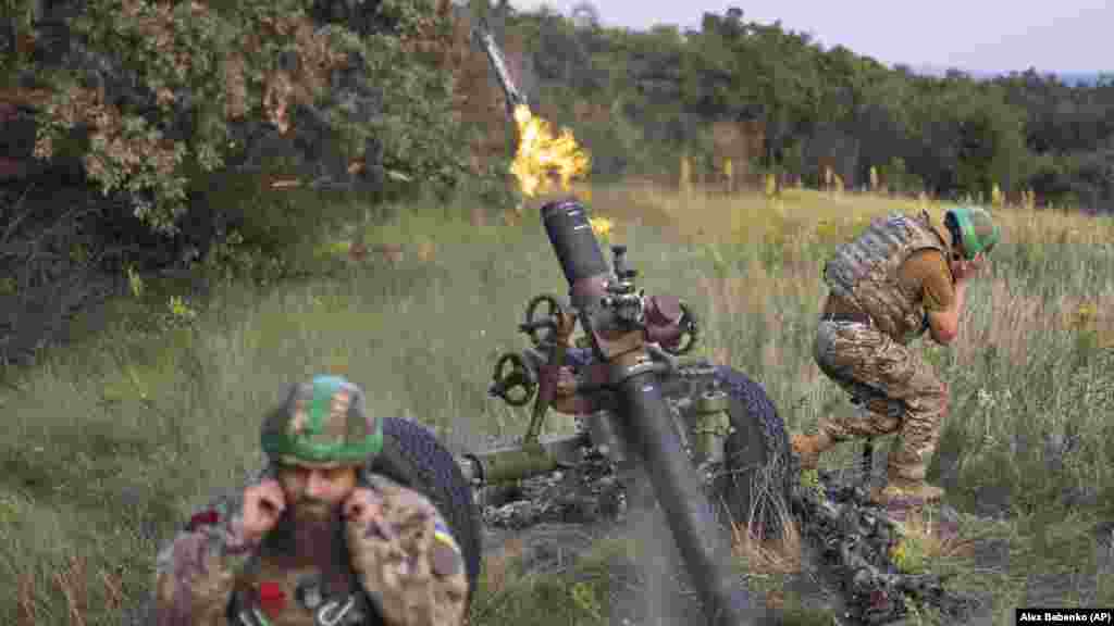 Troops of the 3rd Separate Assault Brigade fire a mortar at Russian positions near Bakhmut.