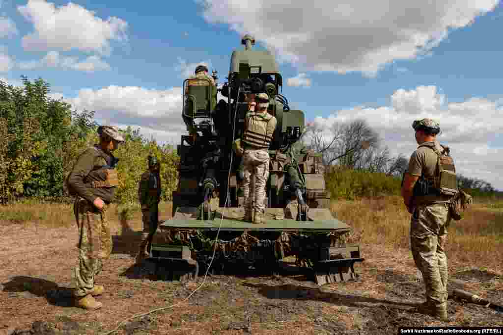 The crew works to reload the Bohdana.&nbsp; Each 155-mm NATO-standard shell used by the howitzer weighs around 40 kilograms -- generally seen as the upper limit for rounds that can be managed by human hands. &nbsp;