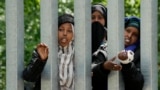 Migrants are blocked from entering Poland by metal barriers erected along the border with Belarus in the Bialowieza Forest on May 29.<br />
<br />
Poland says neighboring Belarus and its main supporter, Russia, are behind a surge in migrants from Belarus toward the European Union in a move to create a crisis.<br />
<br />
<br />
&nbsp;