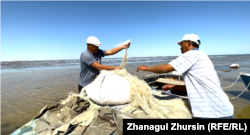 Fishermen prepare their nets.