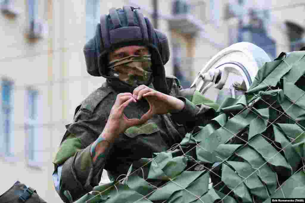 A man reportedly belonging to Wagner gestures to a photographer on the morning of June 24.&nbsp; Russia&rsquo;s Defense Ministry called the &quot;strike&quot; claim a provocation, and some pro-Kremlin figures claimed the video showing the alleged aftermath was staged.&nbsp;