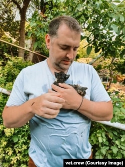 Leonid with two rescued kittens on June 6