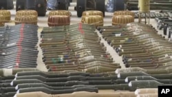 Suspected North Korean-made rocket-propelled grenades are displayed at an Israeli military base following the deadly Hamas assault in October.