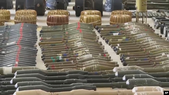 Suspected North Korean-made rocket-propelled grenades are displayed at an Israeli military base following the deadly Hamas assault in October.
